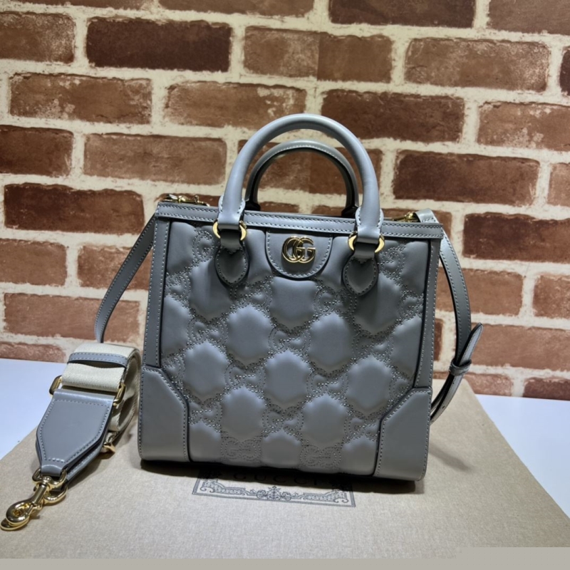G*u*i top handle bags